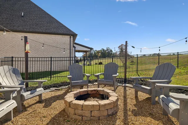 a view of a deck with couches table and chairs