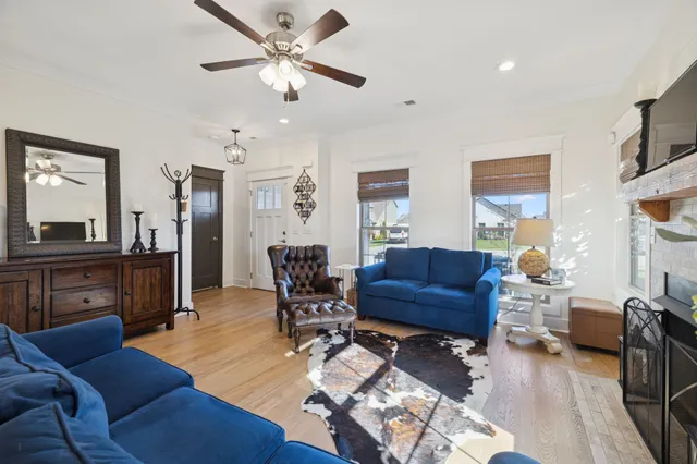 a living room with furniture and a dining table