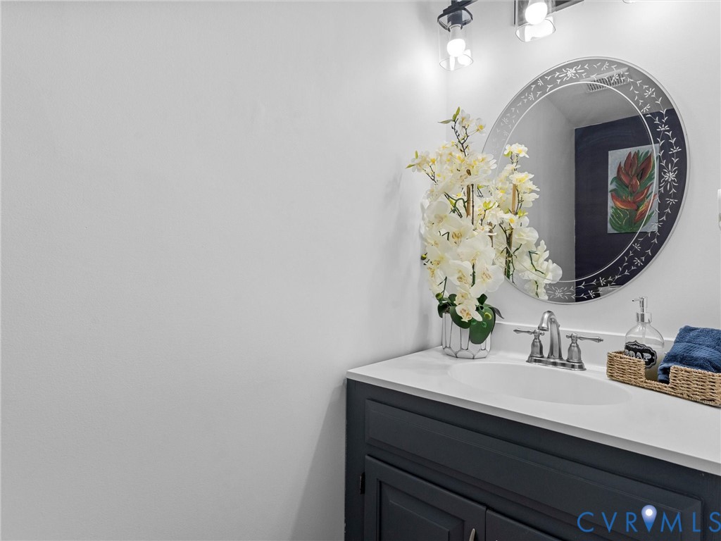 1401 Bramwell Road Richmond, VA 23225 - Photo 11 of 42 a bathroom with a sink and a mirror
