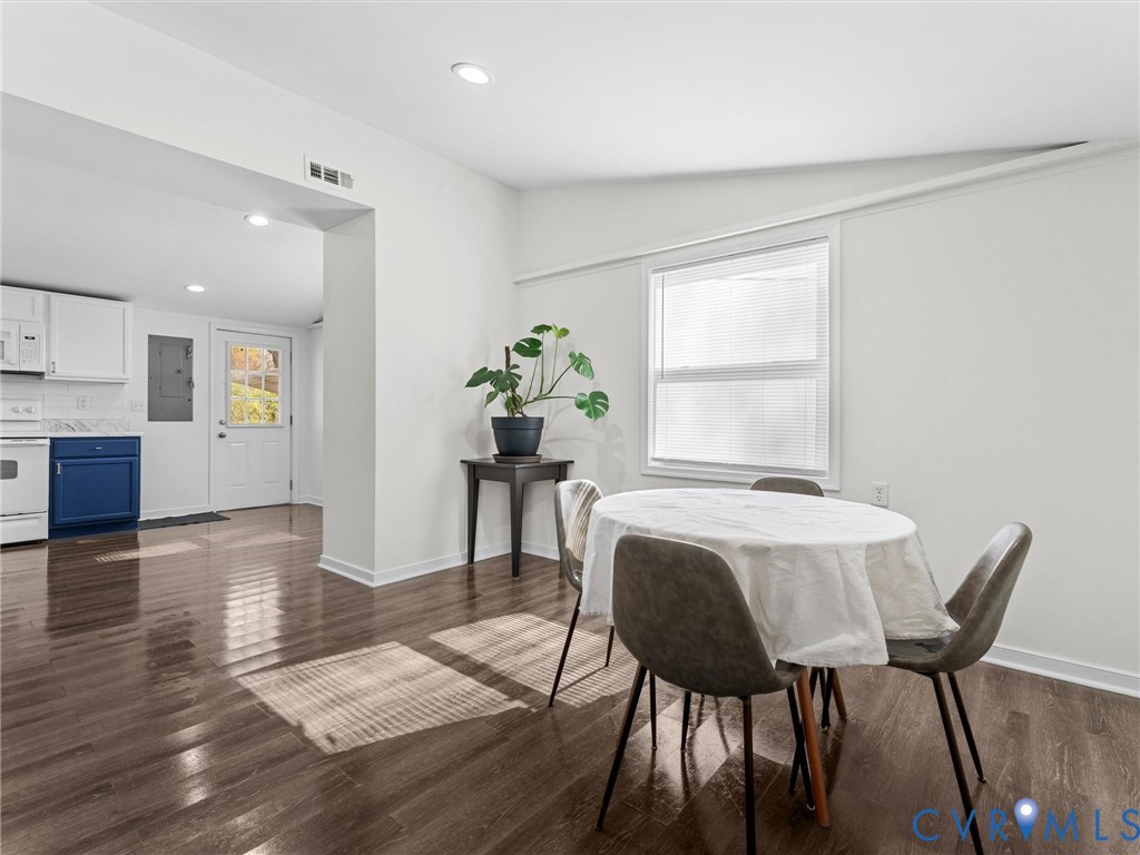 1401 Bramwell Road Richmond, VA 23225 - Photo 13 of 42 a view of a dining room with furniture and wooden floor
