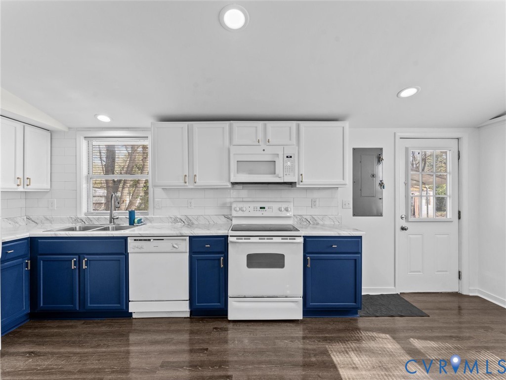 1401 Bramwell Road Richmond, VA 23225 - Photo 18 of 42 a kitchen with stainless steel appliances granite countertop a stove a sink dishwasher and a refrigerator