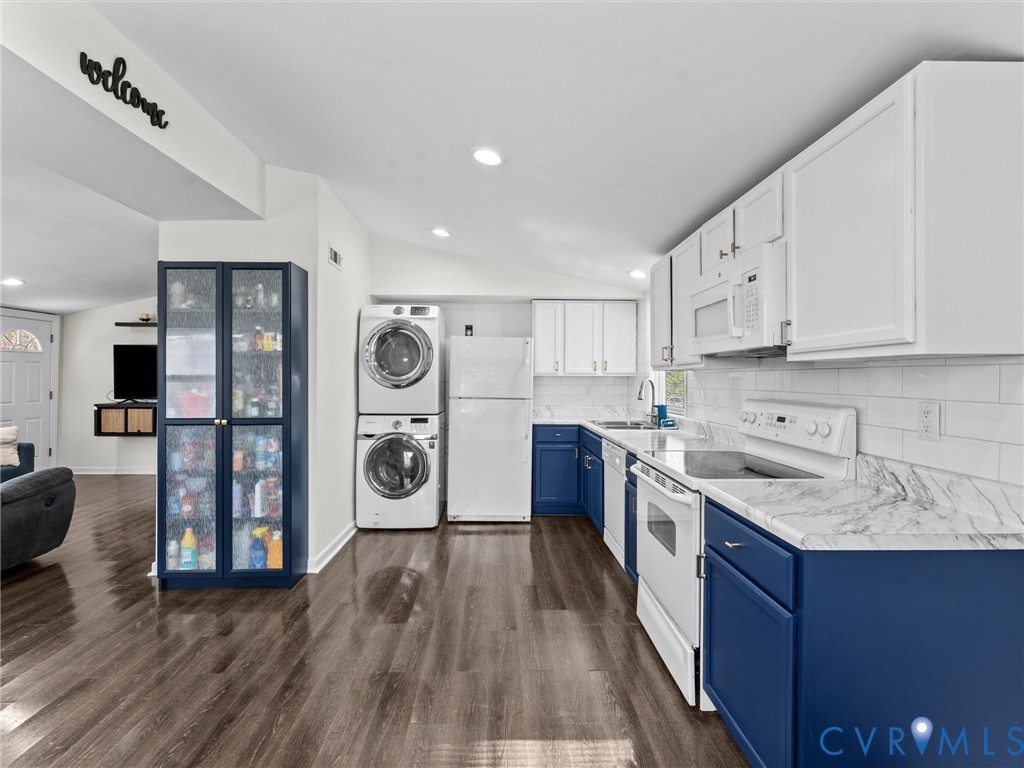1401 Bramwell Road Richmond, VA 23225 - Photo 20 of 42 a kitchen with stainless steel appliances granite countertop a refrigerator a sink dishwasher and a stove with wooden floor
