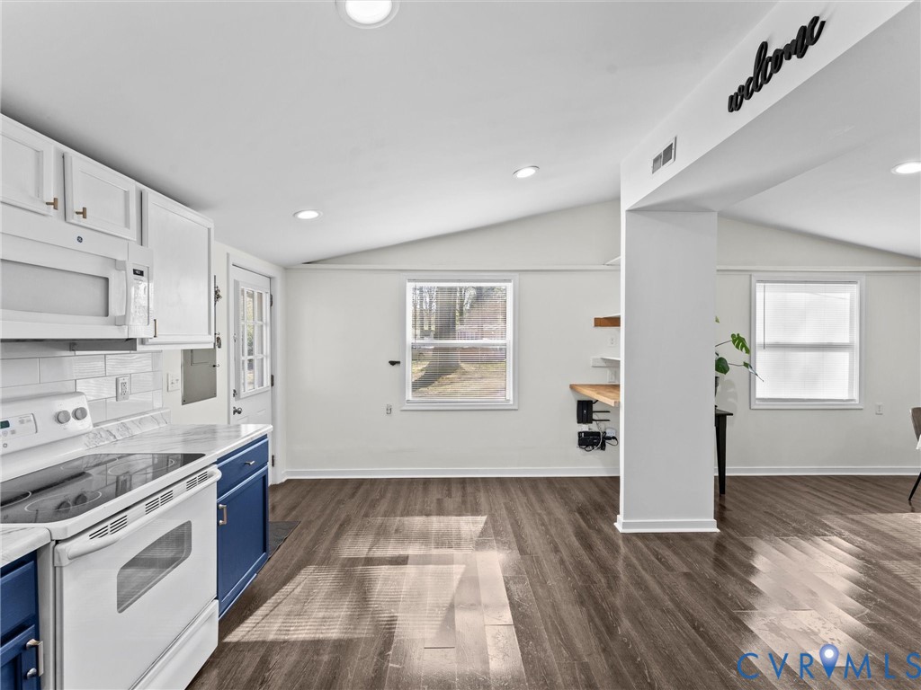 1401 Bramwell Road Richmond, VA 23225 - Photo 23 of 42 a kitchen with granite countertop white cabinets and wooden floor