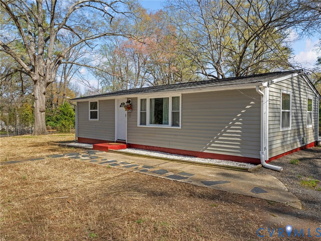 1401 Bramwell Road Richmond, VA 23225 - Photo 32 of 42 a view of a house with a yard and garage