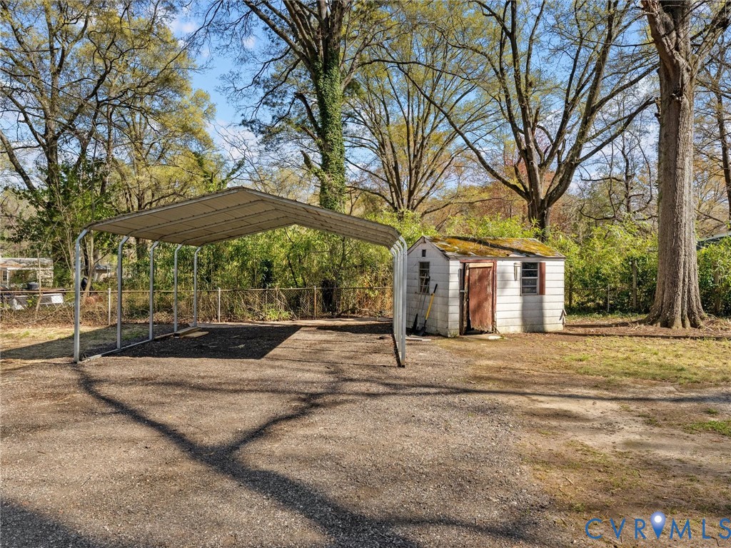 1401 Bramwell Road Richmond, VA 23225 - Photo 36 of 42 a house with yard and trees in front of it