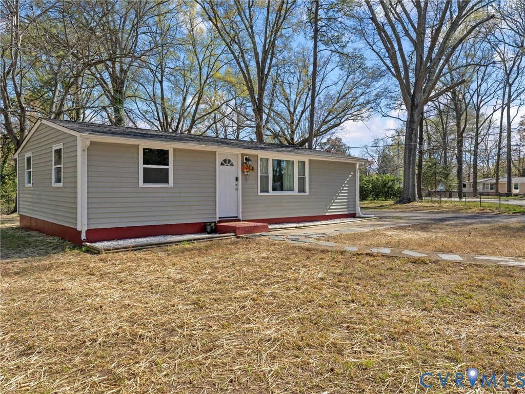 1401 Bramwell Road Richmond, VA 23225 - Photo 5 of 42 a house with trees in front of it