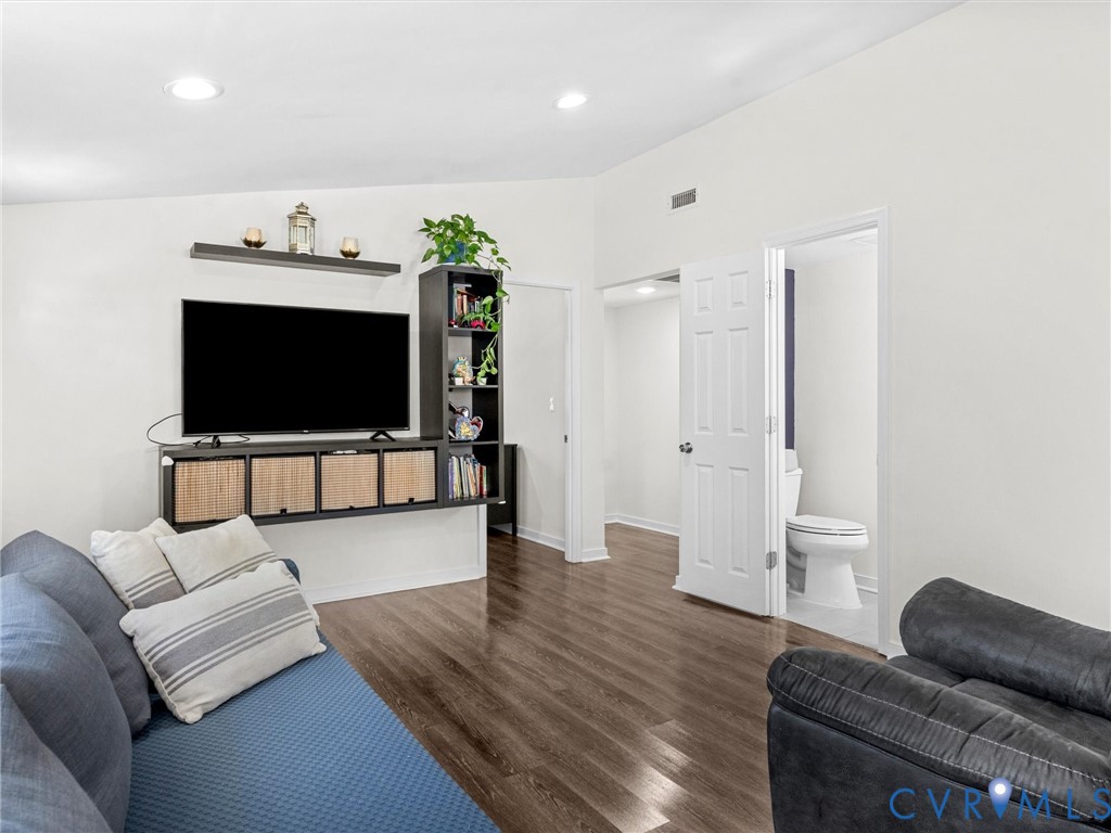 1401 Bramwell Road Richmond, VA 23225 - Photo 10 of 42 a living room with furniture and a flat screen tv
