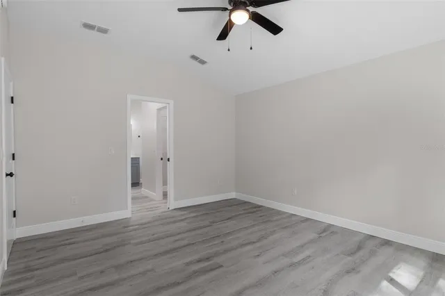a spacious bathroom with a shower and a sink