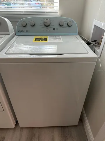 a view of a big room with windows