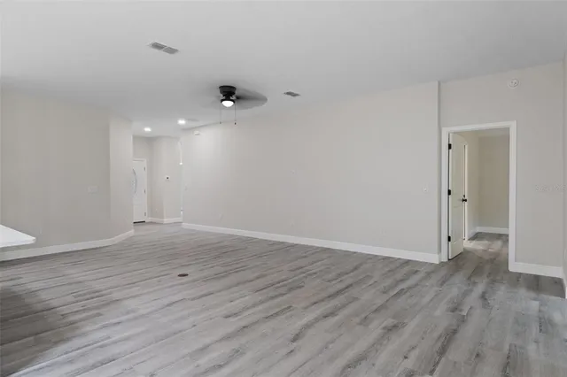 a view of kitchen with wooden floor and window