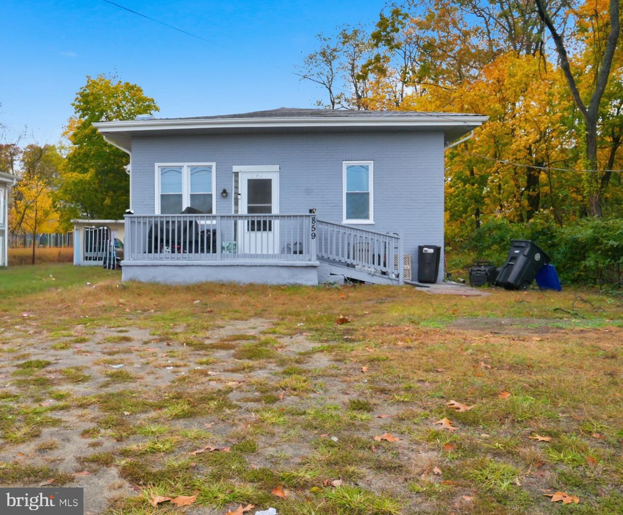a house view with swimming pool in front of it