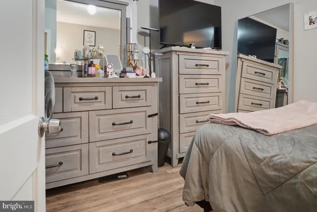 a bed room with a bed and a television