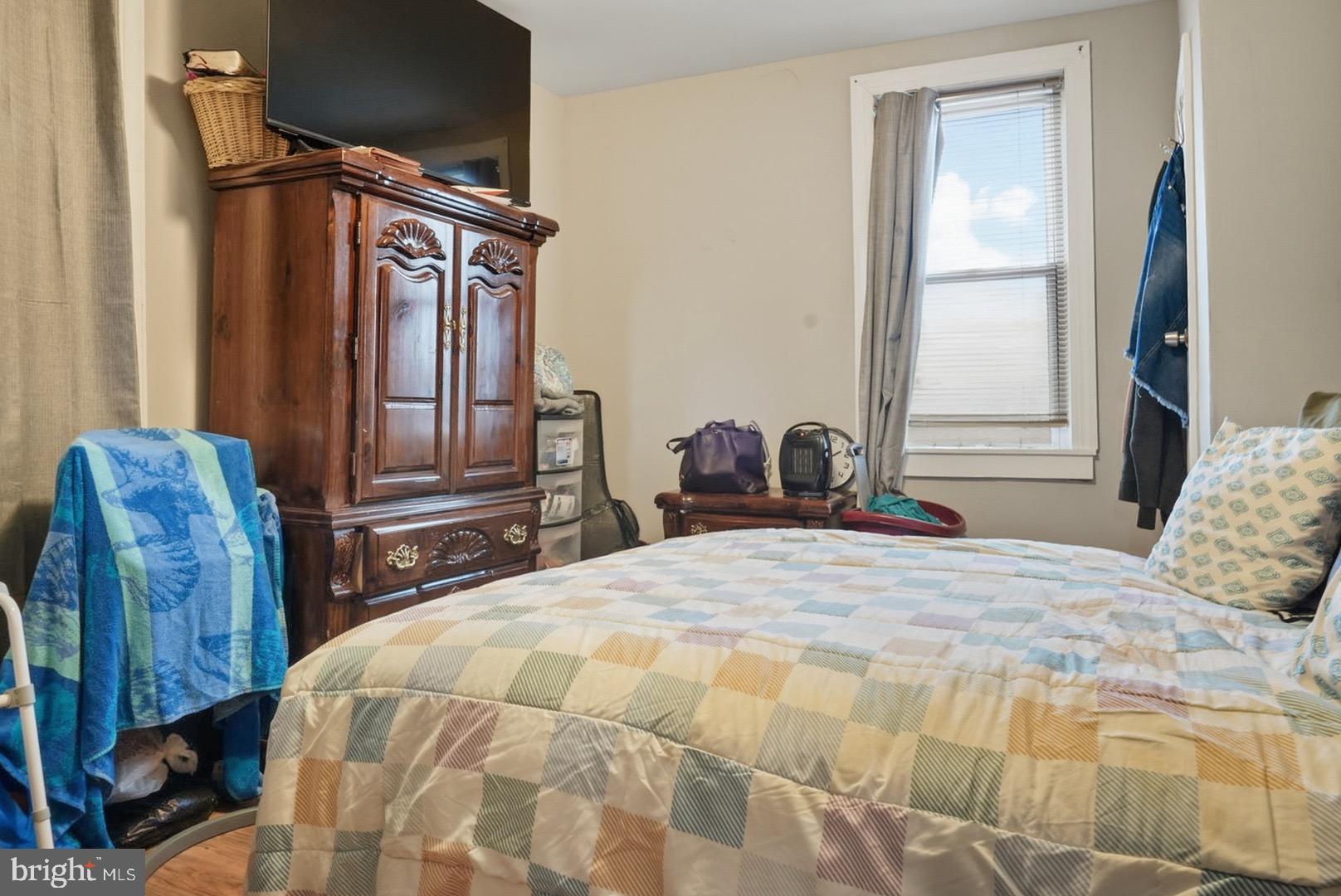 859 Cattell Road Wenonah, NJ 08090 - Photo 14 of 24 a bedroom with a bed a dresser and mirror