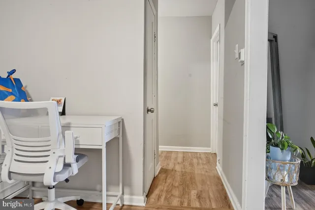 a view of a hallway with seating area