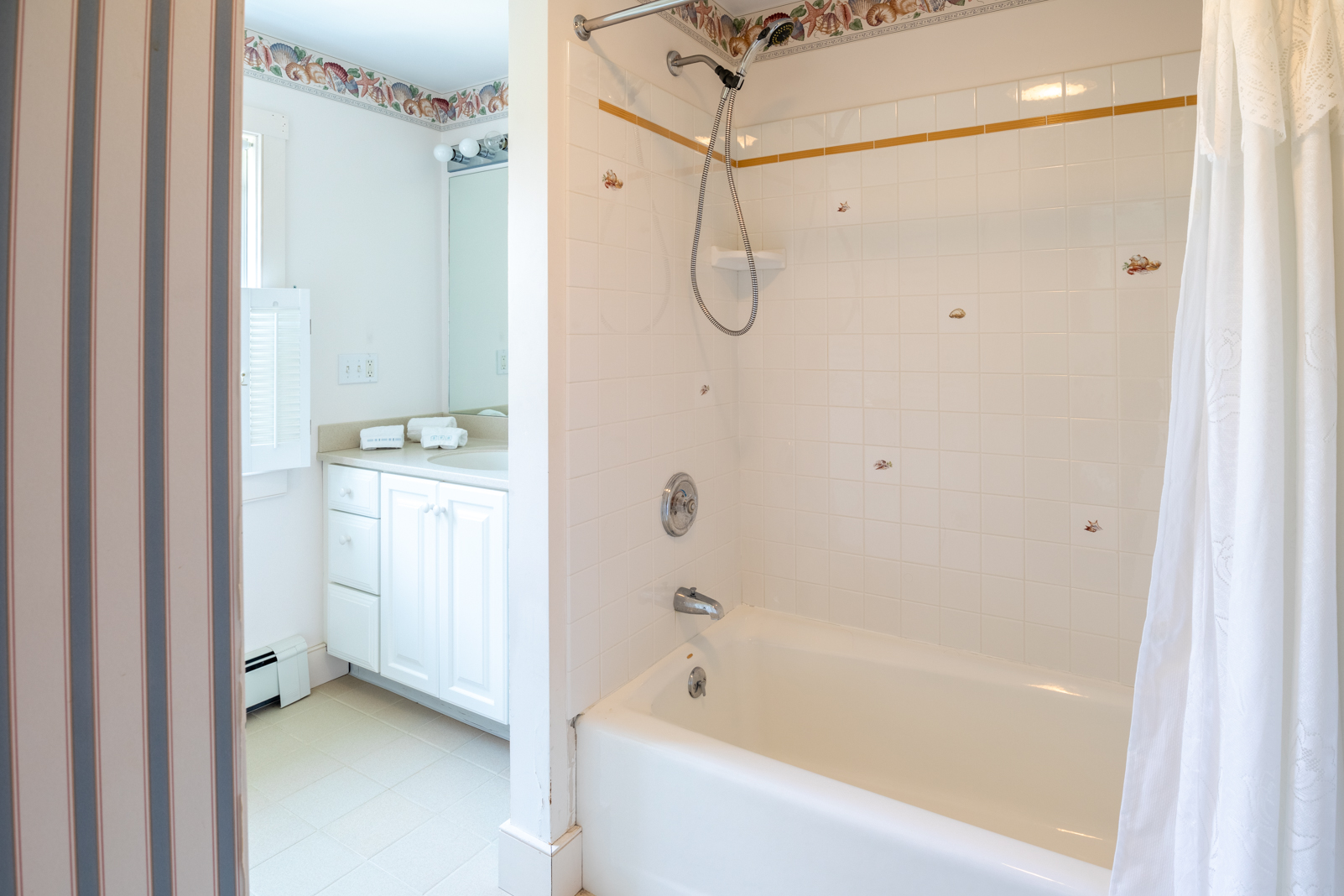 15 Swift Rock Road Nantucket, MA 02554 - Photo 25 of 32 a bathroom with a bathtub a shower a toilet and a shower