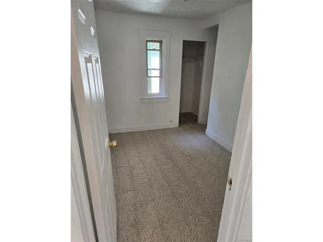 a view of an empty room with window