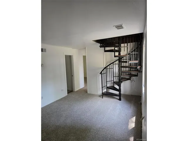 a view of a hallway with a room