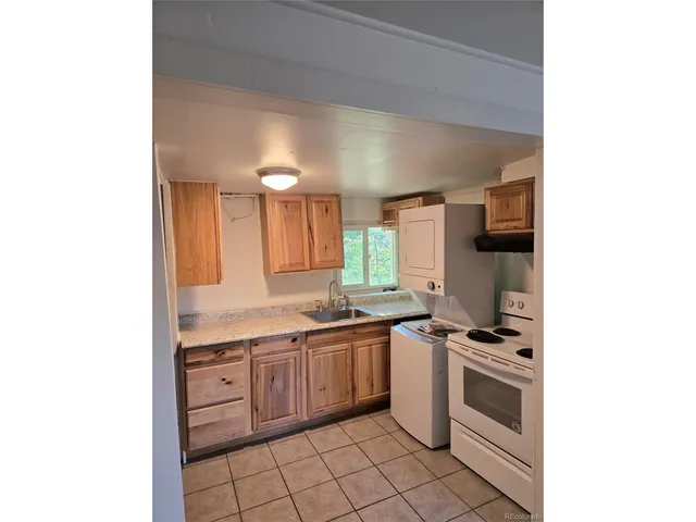 a view of a room with a large window