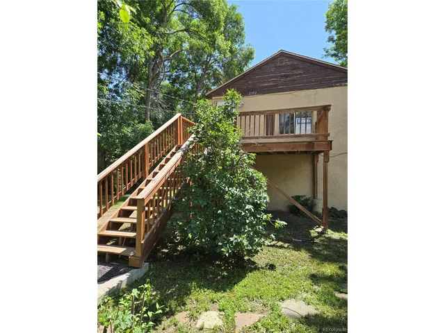 a view of balcony with wooden floor