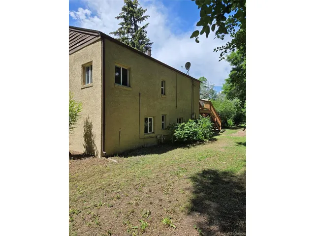 a view of balcony with wooden floor and umbrella