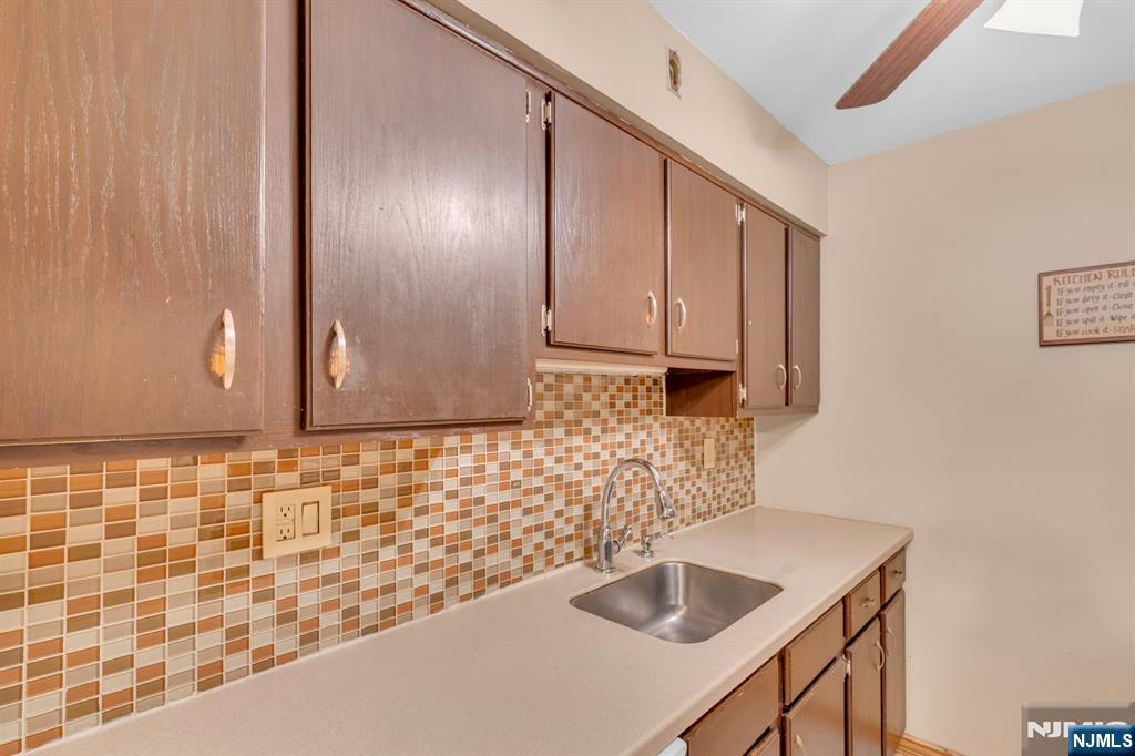 666 Mill Street, Unit C6 Belleville, NJ 07109 - Photo 10 of 25 a bathroom with a sink and a mirror