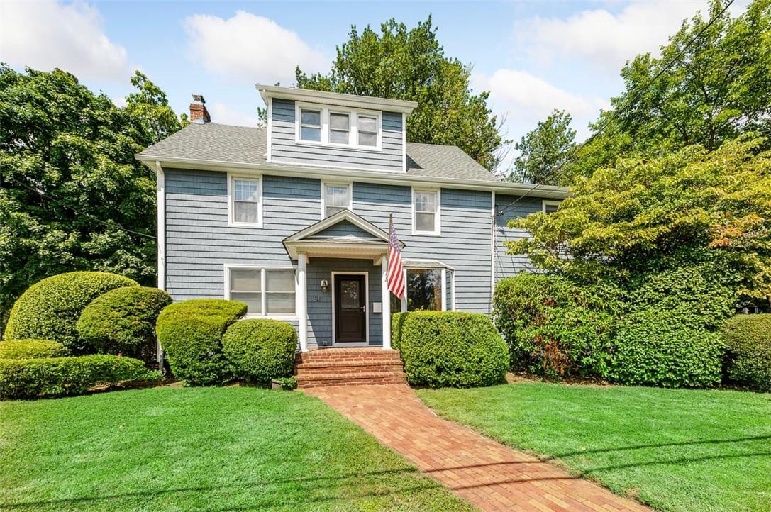 51 Scott Avenue Jericho, NY 11753 - Photo 1 of 1 a front view of a house with a garden