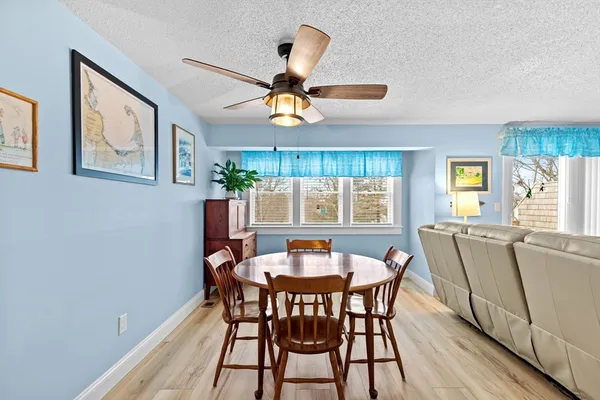 a dining room with furniture and window