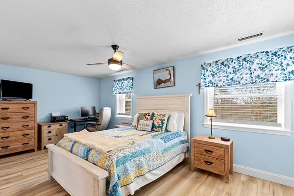 a bed room with bed and window