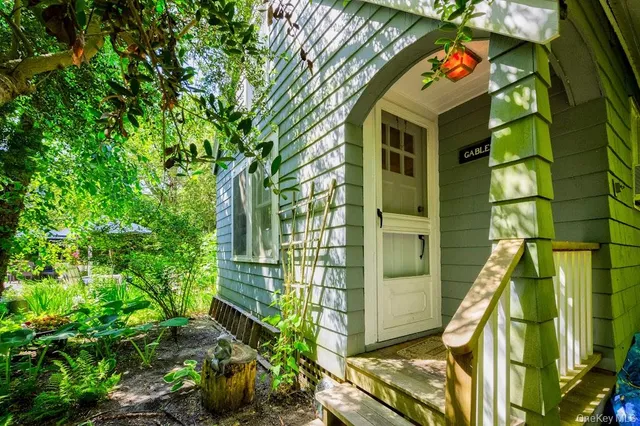 a view of a house with a street