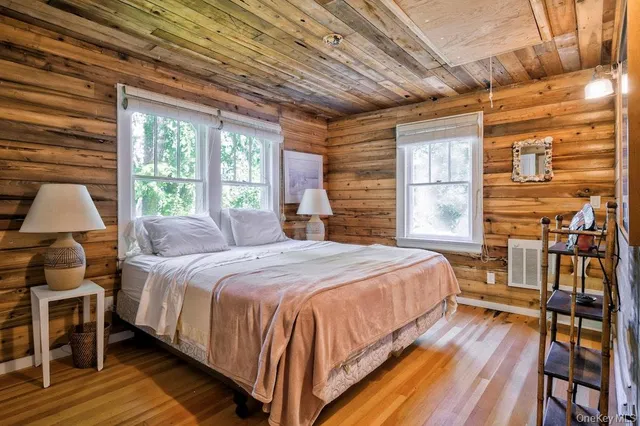 a bedroom with a bed and a chair