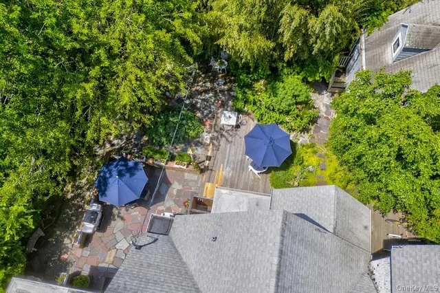 an aerial view of a house with a yard and garden