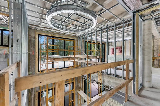a view of a room with table and chairs