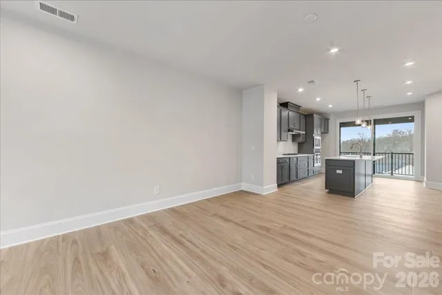 a spacious bathroom with double sink and a mirror