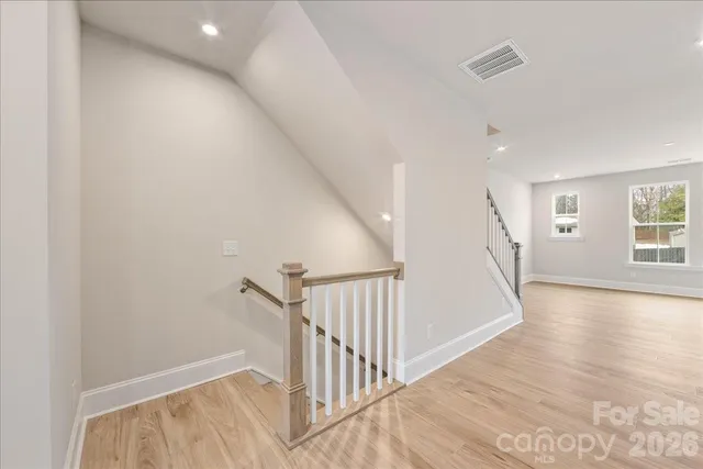 a large kitchen with kitchen island a sink stainless steel appliances and cabinets