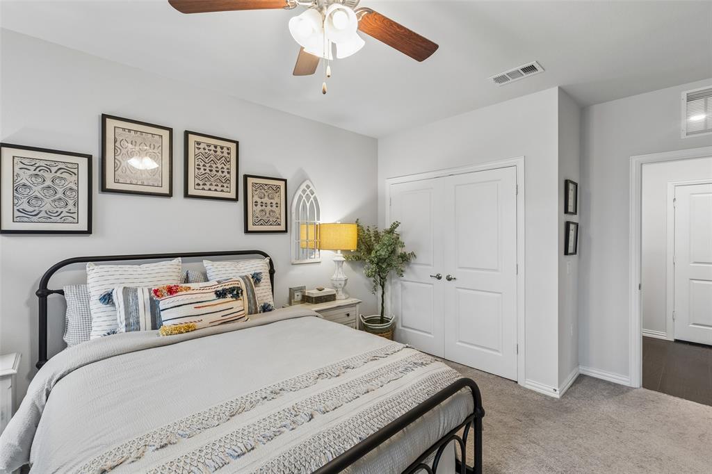 651 Watters Road, Unit 7204 Allen, TX 75013 - Photo 27 of 40 a bedroom with a bed and a dresser