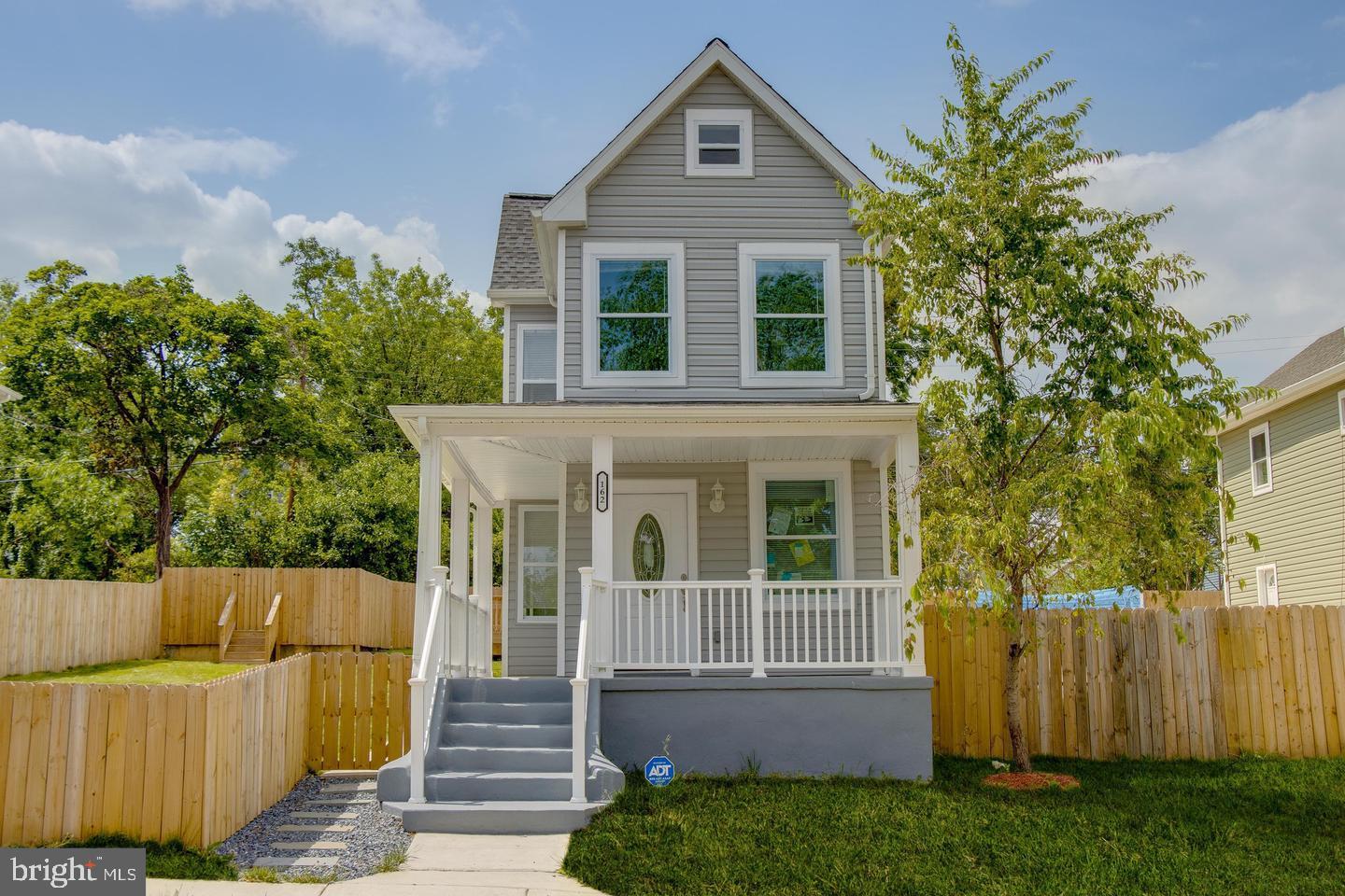 a view of house with a yard