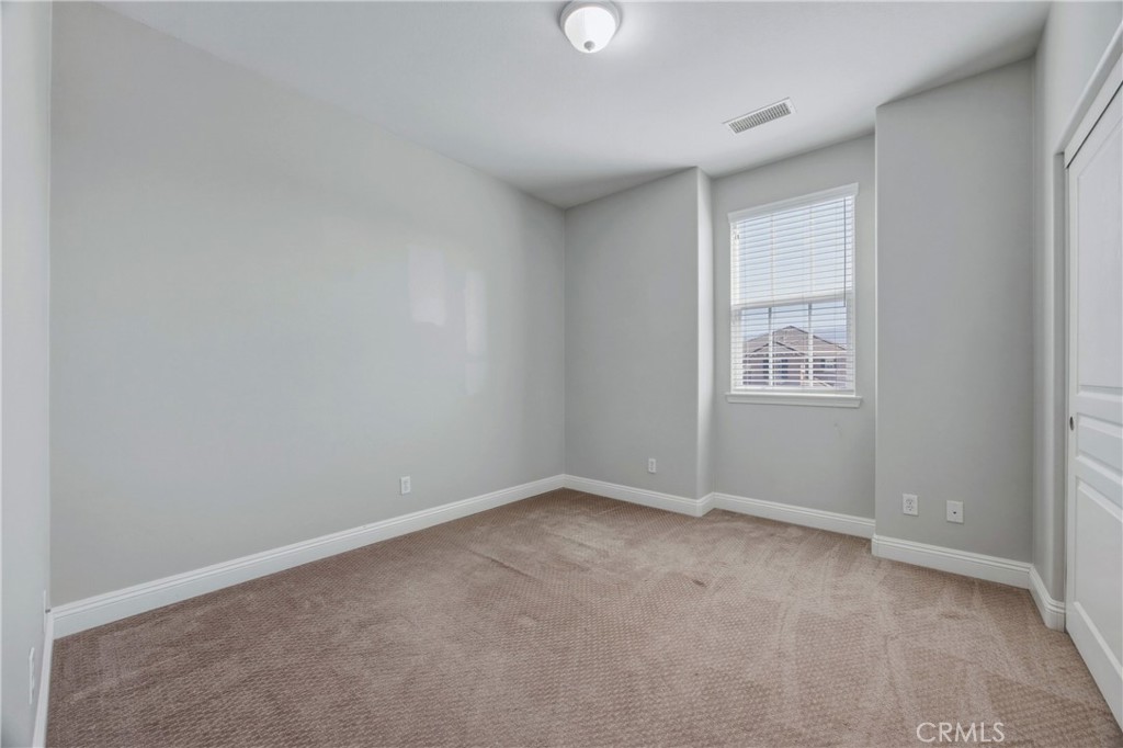 32056 Red Mountain Way Temecula, CA 92592 - Photo 18 of 28 an empty room with windows