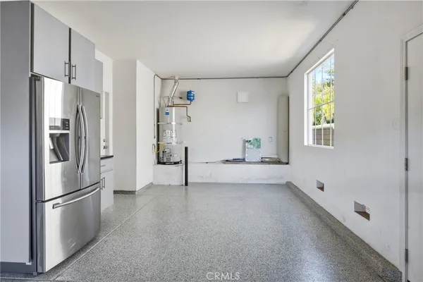 a view of a room with cabinet and mirrors