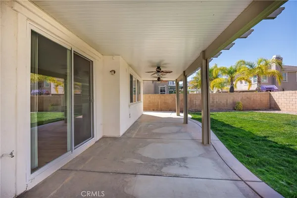 a front view of a house with a yard porch and seating area