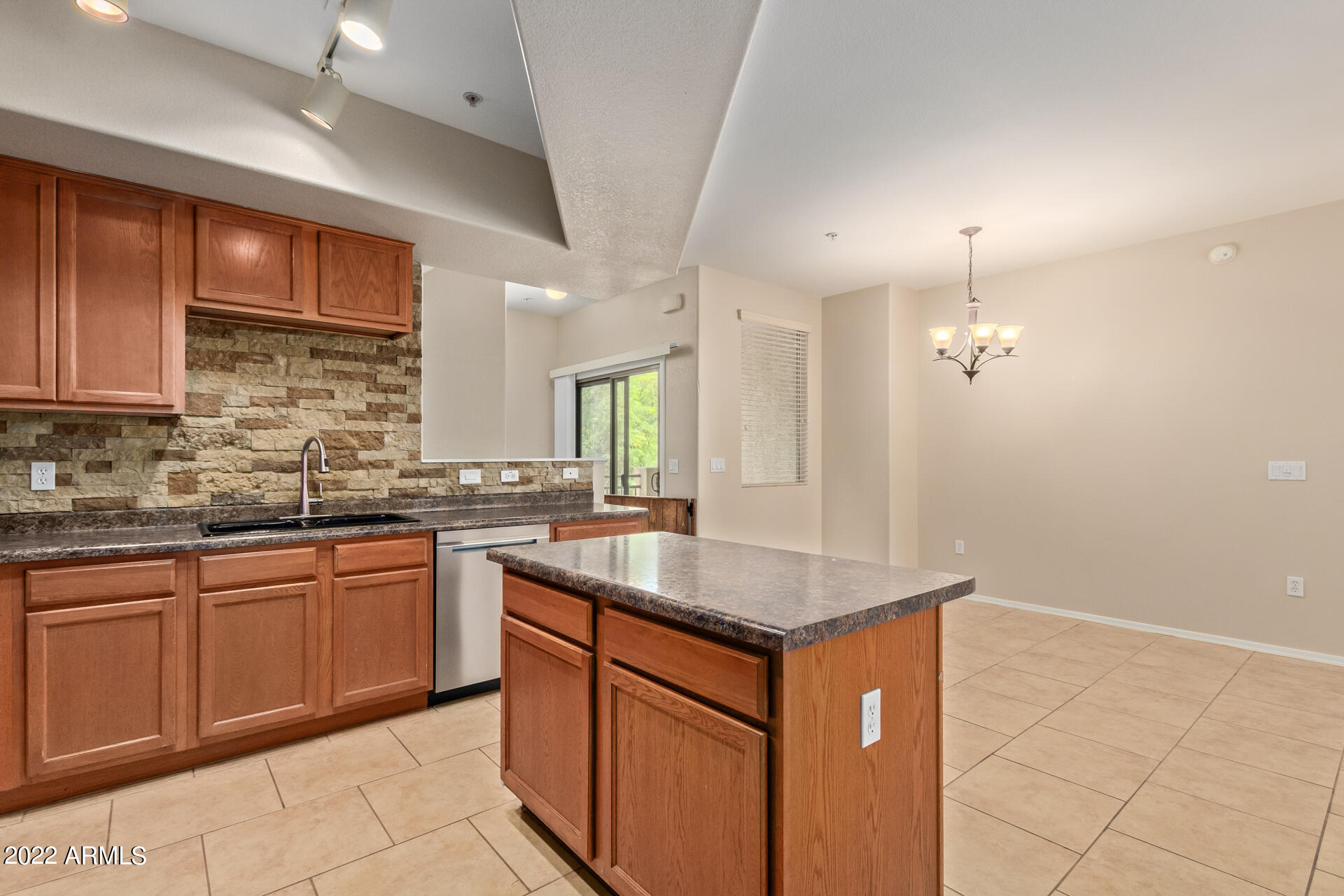 2150 West Alameda Road, Unit 1391 Phoenix, AZ 85085 - Photo 22 of 63 a kitchen with stainless steel appliances granite countertop a sink stove and refrigerator