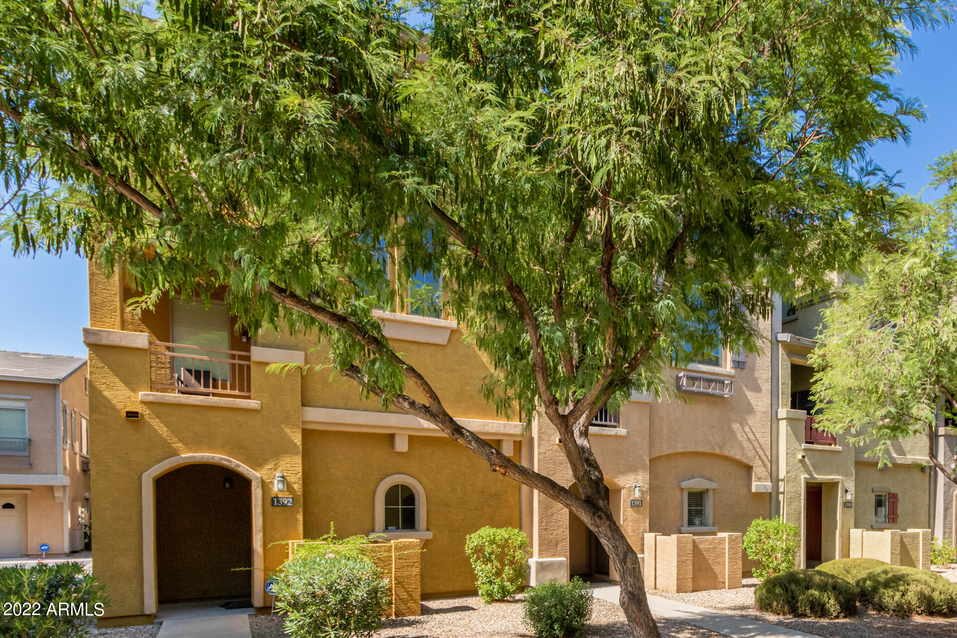 2150 West Alameda Road, Unit 1391 Phoenix, AZ 85085 - Photo 4 of 63 a front view of a house with a tree