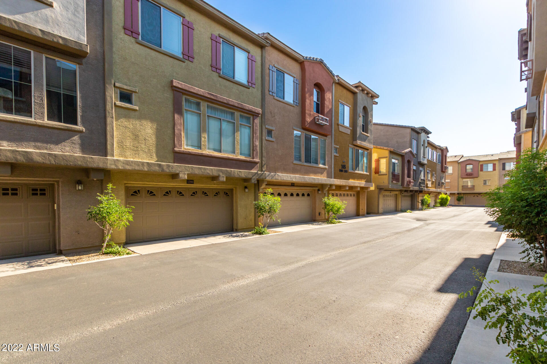 2150 West Alameda Road, Unit 1391 Phoenix, AZ 85085 - Photo 44 of 63 a front view of a building with a street