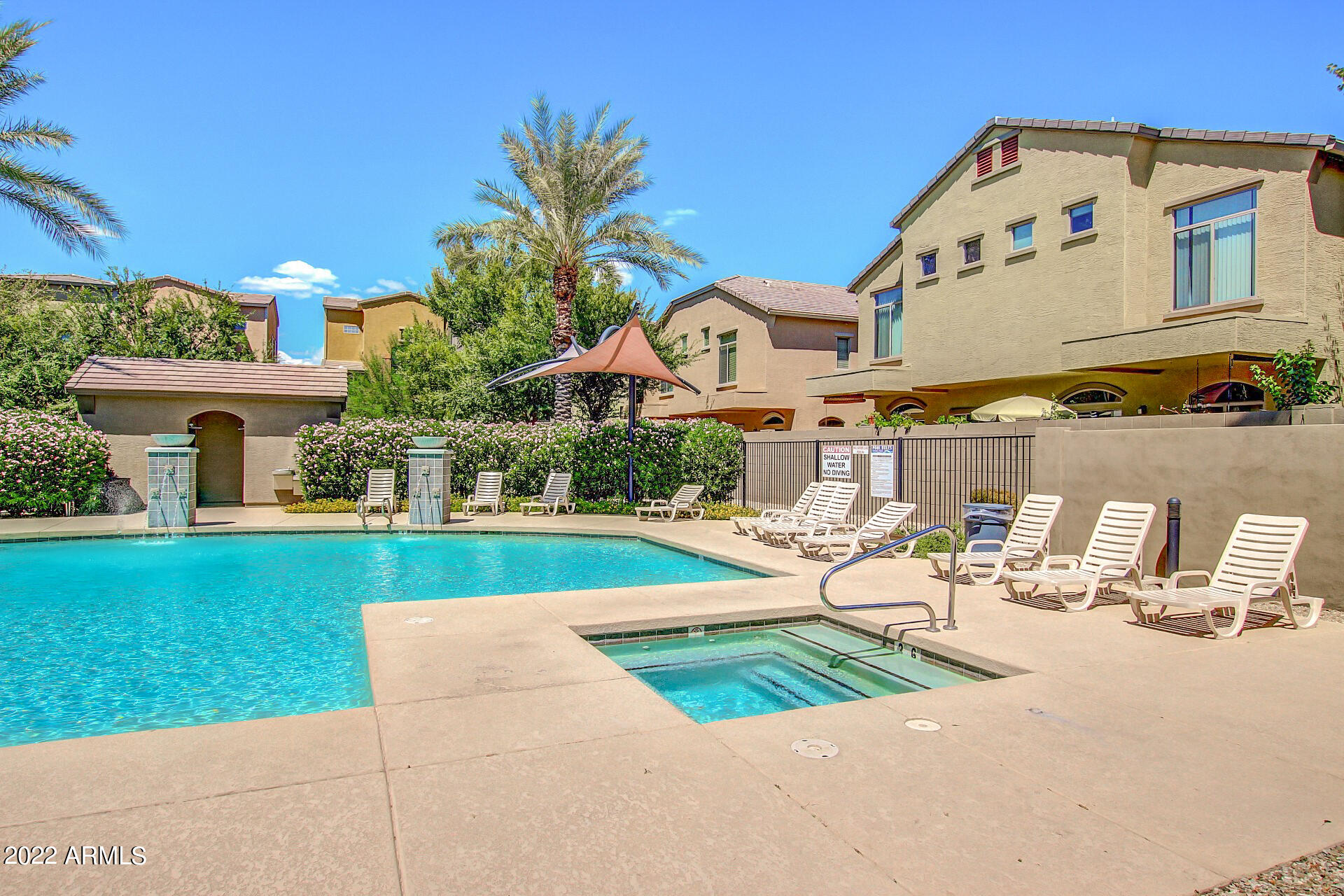 2150 West Alameda Road, Unit 1391 Phoenix, AZ 85085 - Photo 46 of 63 a front view of a house with garden and sitting area