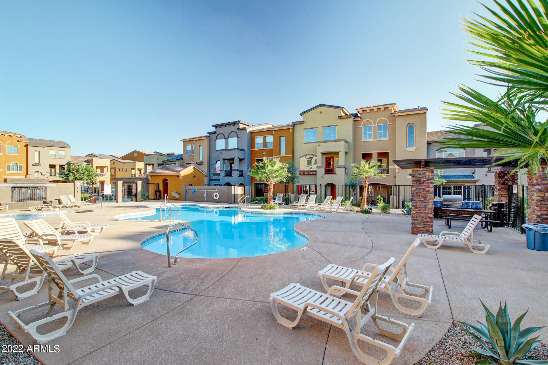 2150 West Alameda Road, Unit 1391 Phoenix, AZ 85085 - Photo 55 of 63 a view of a swimming pool with chairs
