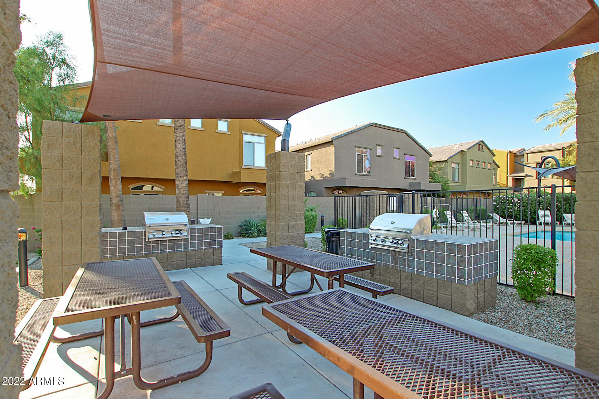 2150 West Alameda Road, Unit 1391 Phoenix, AZ 85085 - Photo 56 of 63 a view of a patio with couches table and chairs