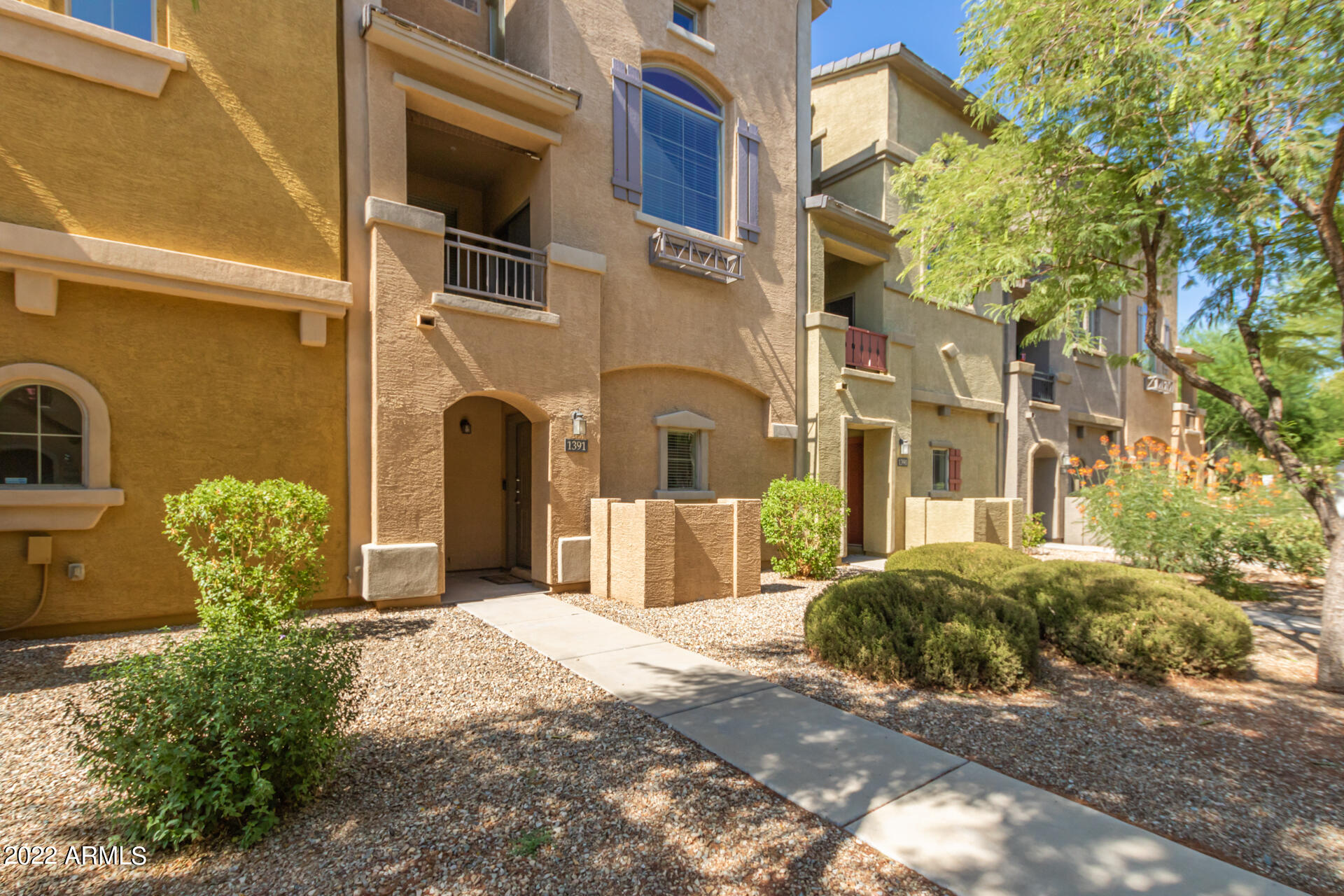 2150 West Alameda Road, Unit 1391 Phoenix, AZ 85085 - Photo 7 of 63 a front view of a house with yard