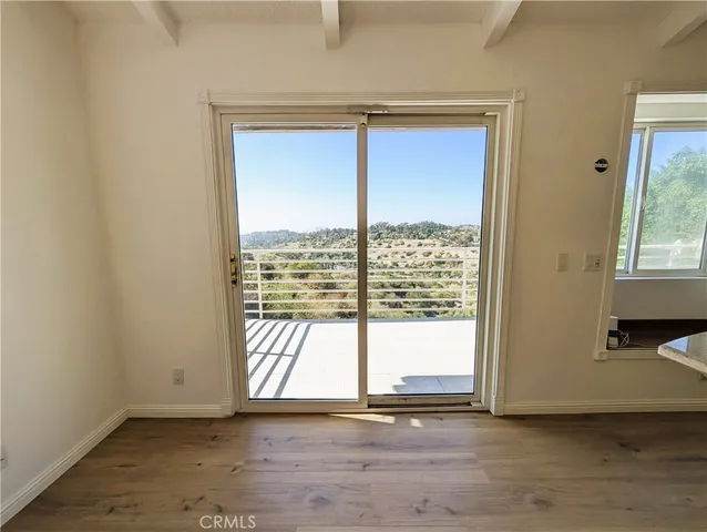 a bathroom with a sink toilet and window