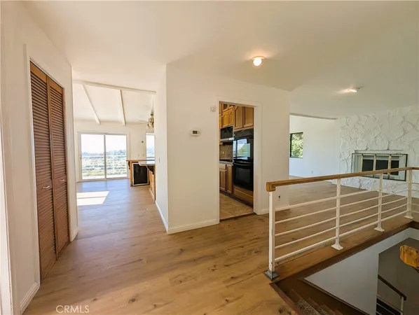 a bedroom with a bed and a mirror