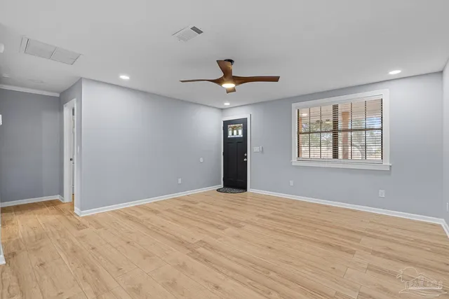 a view of an empty room with a window