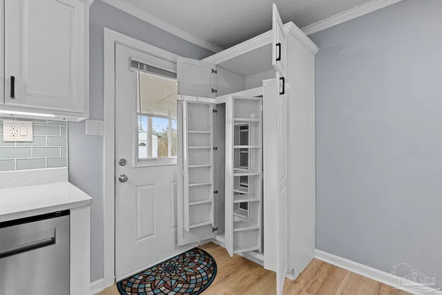 a view of walk in closet with empty racks